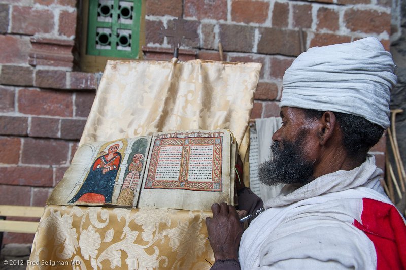 20120403_163836 Nikon D3S 2x3.jpg - Priest reading from rare old book